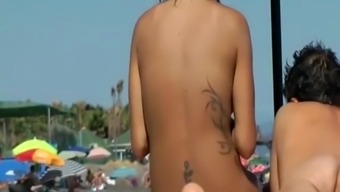 spy tattoo voyeur beach